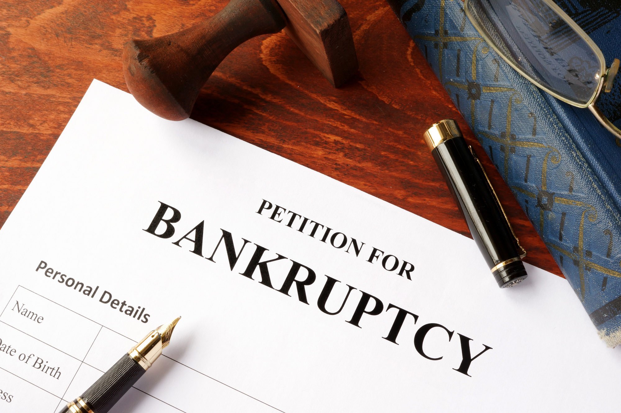 Petition for Bankruptcy on an office table.